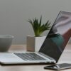 Silver Laptop and White Cup on Table